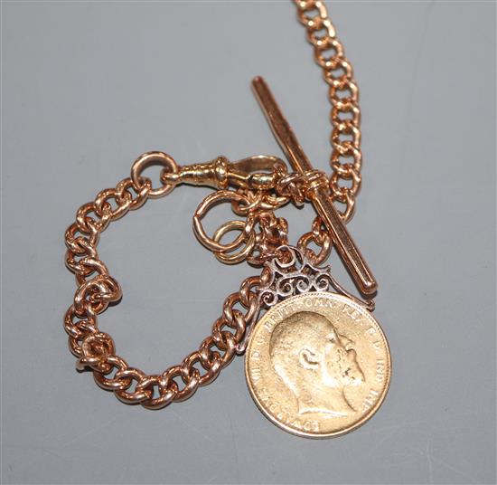 An 18ct gold curb-link watch chain with 1902 gold sovereign fob, gross 55.2 grams.